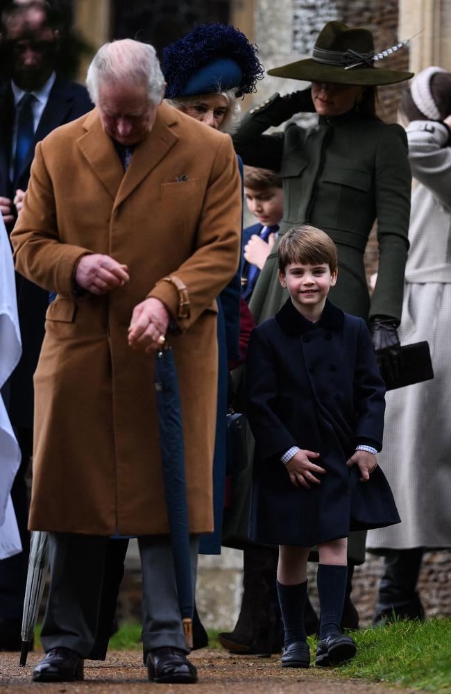 Prince Louis of Wales (C) leaves next to Britain's King Charles III after the Royal Family's traditional Christmas Day service at St Mary Magdalene Church in Sandringham, Norfolk. Pictuire: AFP