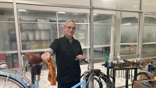 Dave Phillips has been running his Pedal Power Plus bike servicing business out of a temporary shop 50m from its regular home, which is still being repaired.