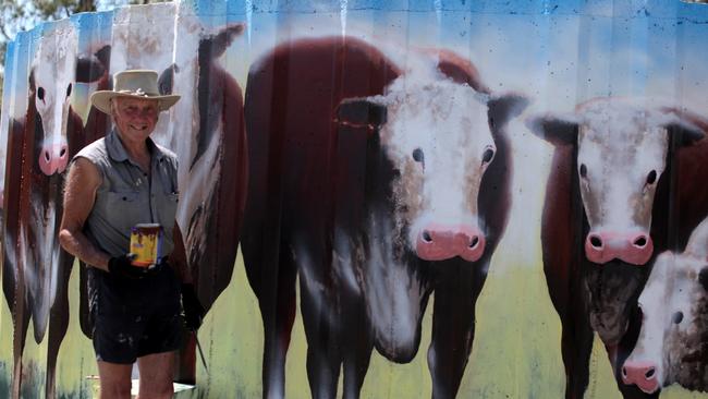 Omeo artist Terry Petersen takes a break from painting the mural. Picture: Jason Palmer