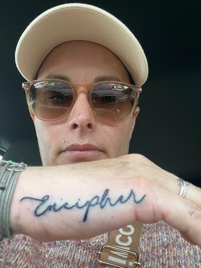 Emma Stewart shows off her Encipher tattoo after winning The Eureka last year. Picture: Emma Stewart