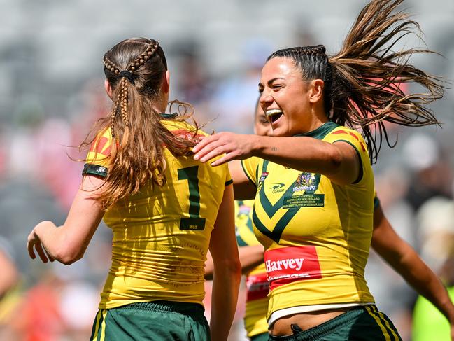 Millie Elliott (r) celebrates with try-scorer Tamika Upton. Picture: Izhar Khan/Getty Images