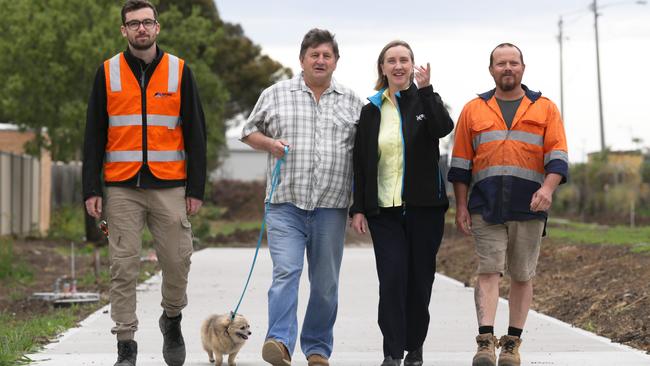 Mayor Geoff Porter, with his dog Peppa, and Cr Karen Sherry celebrate more funding for open space at Meadowlink in Broadmeadows with workers Henry Sheppard and Brett Jones. Picture: George Salpigtidis