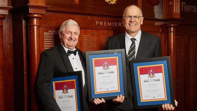 Peter Vivian and Darren Smith pose with Harry Kernahan's award at Adelaide Oval after being inducted into the South Australian Football Hall of Fame on Wednesday night. Picture: Matt Loxton