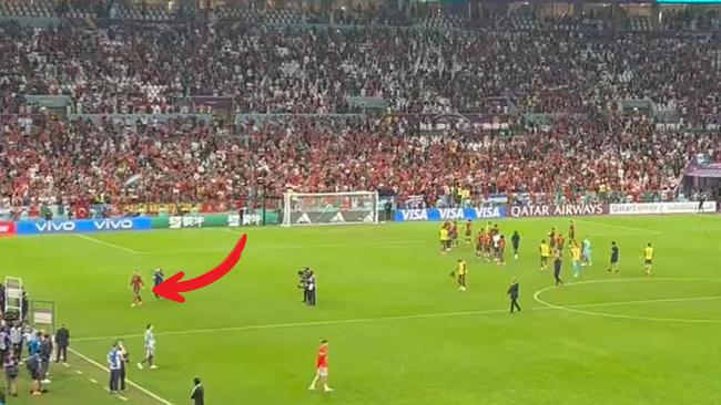 Cristiano Ronaldo walks off while his team celebrate the win over Switzerland.