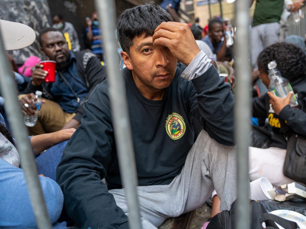 A man waits in line to be processed at a makeshift immigration centre (Photo by SPENCER PLATT / GETTY IMAGES NORTH AMERICA / Getty Images via AFP)