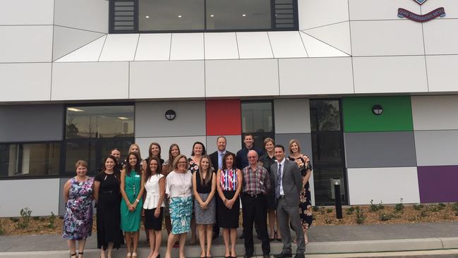 The first teachers and head Joel Weekes outside the new St Gregory's College Junior School. Picture: Joel Weekes