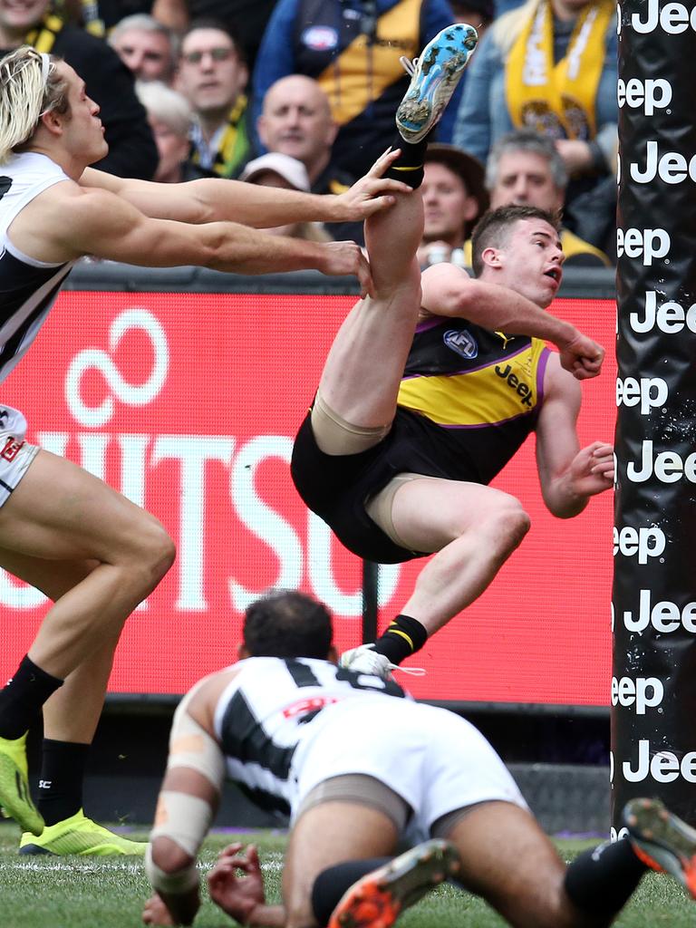 Jack Higgins somehow gets his boot to the ball. Picture: Michael Klein