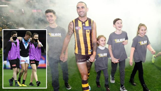 Hawk Shaun Burgoyne was feted ahead of his 400th game, but Power superboot Kane Farrell suffered what appeared to be a serious injury.