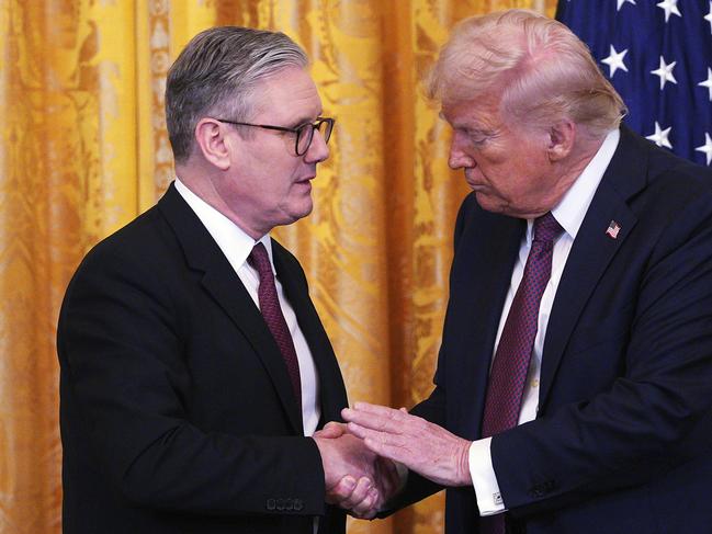 FILE - Britain's Prime Minister Keir Starmer, left, and U.S. President Donald Trump shake hands at a joint press conference in the East Room at the White House Thursday, Feb. 27, 2025, in Washington. (Carl Court/Pool Photo via AP, File)