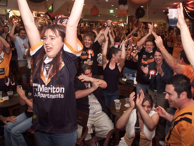 Wests Tigers fans at Balmain Leagues Club celebrate victory in the Grand Final in 2005. 