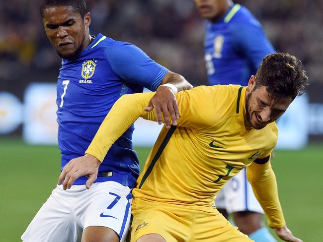 Milos Degenek tangles with Brazil’s Douglas Costa