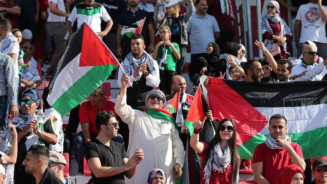 Palestine supporters cheer on their team. Picture: AFP