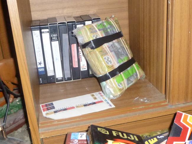 A large quantity of cash seized in raids on bikie clubhouses across Tasmania in 2015.