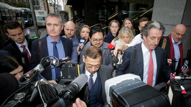 Ernest Wong (centre) leaves the ICAC in Sydney. Picture: Liam Driver