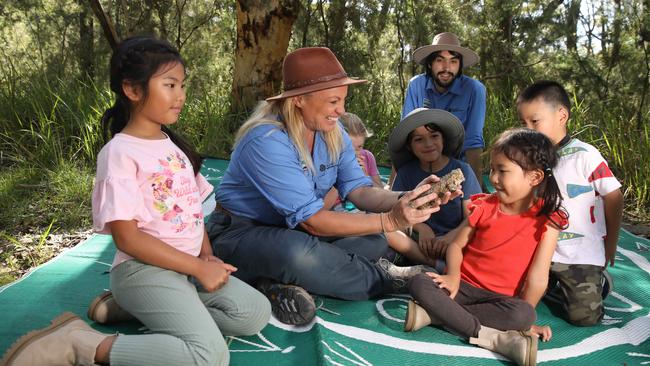 Amber Castle, Kieren Boyd-Weetman and Bernie the lizard teach the little Ku-ring-gai rangers about bushland. Picture: Renee Nowytarger