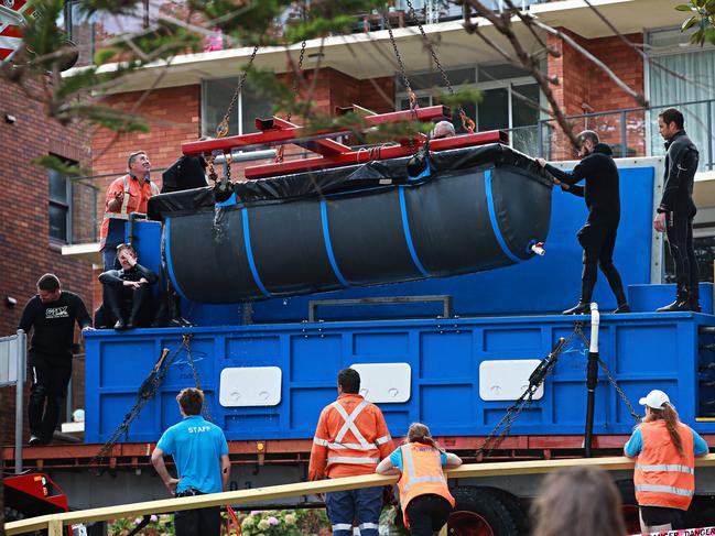 A shark is removed from the former Sea Life aquarium after ti closed in 2018. Picture: Adam Yip