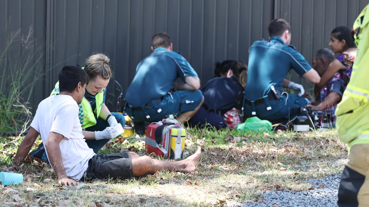 Emergency services personnel respond to a collision between a small car and a cane train at a level crossing on Beatrice Street, Mooroobool. Three occupants of the car were treat at the scene by paramedics before being transported to hospital with minor injuries. Picture: Brendan Radke