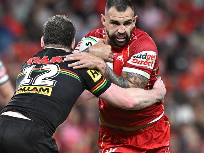 BRISBANE, AUSTRALIA - APRIL 10: Josh Kerr of the Dolphins takes on the defence during the round six NRL match between Dolphins and Penrith Panthers at Suncorp Stadium, on April 10, 2025, in Brisbane, Australia. (Photo by Bradley Kanaris/Getty Images)