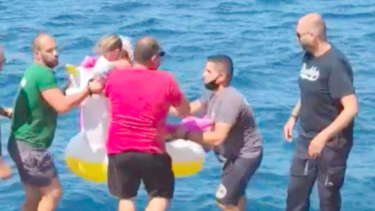 Girl rescued after she was swept to sea on giant inflatable unicorn ...