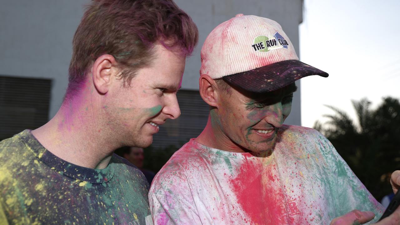 Steve Smith and Marnus Labuschagne of Australia participate in a traditional Holi celebration.