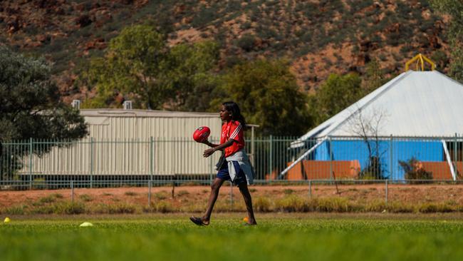 Melbourne Demons players Shane McAdam and Andy Moniz-Wakefield went to Santa Teresa ahead of the 2025 AFL game in Alice Springs. Picture: Melbourne Demons
