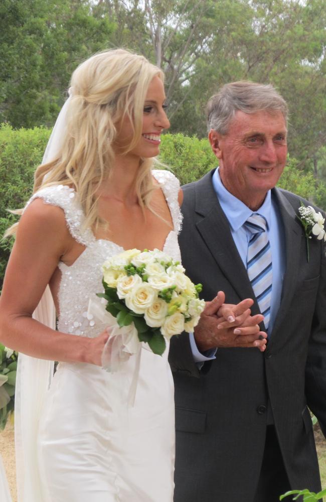 Ross walks Laura down the aisle at her wedding to Gilbride at Scots College in Warwick. Picture: Linda Mantova / Warwick Daily News