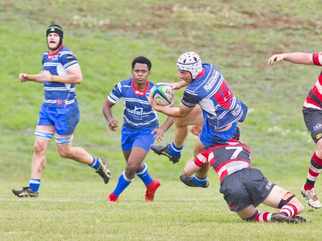 USQ's Angus Ramsey is caught in the Rangers' defence. Saints will look to his experience to help guide them to victory over Condamine in today's knock-out semi-final.