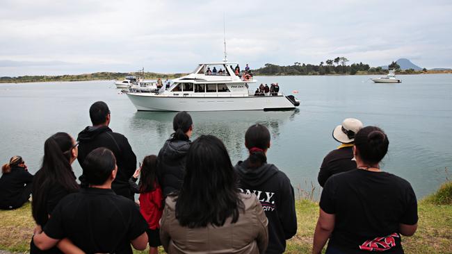 Families of the victims returning from blessing to military personal. Picture: Adam Yip