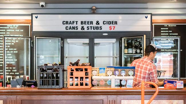 A bar manager clears out of the bar fridge at the Notting Hill Pub in Melbourne. Picture: Asanka Ratnayake/Getty Images.