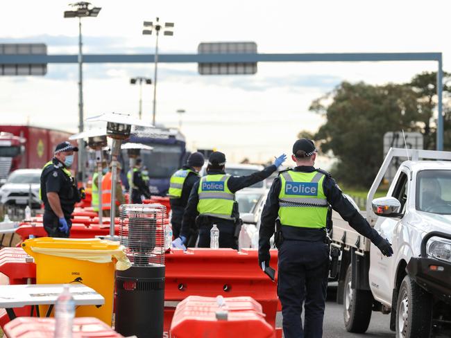 Police check permits and driver IDs near Geelong. Picture: Getty Images