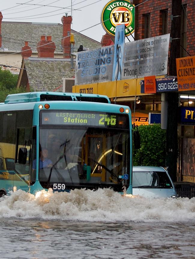 A bus battles through floodwater on Punt Road (St Kilda Junction) in 2011. Picture: HWT Library.