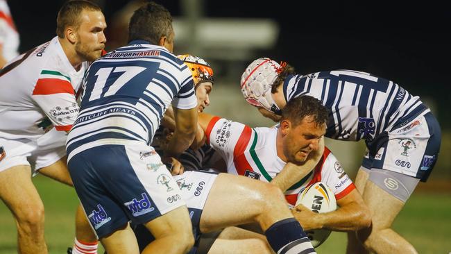 Nightcliff’s David Paull receives heavy attention from the Brothers’ defence during their drawn NRL NT clash. Picture: Glenn Campbell