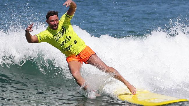 in preparation for Aussie life, The <i>Manly Daily </i>arranged for the reality star to have his first ever surfing lesson. Picture: Braden Fastier