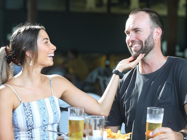 The Queensland Government has relaxed mandates on wearing face masks in public areas, meaning that patrons can breathe easier in hospitality venues. Shelby Crouche put on lipstick and Jason Preece trimmed his beard before catching up with friends at Hemmingways Brewery on Saturday afternoon. Picture: Brendan Radke