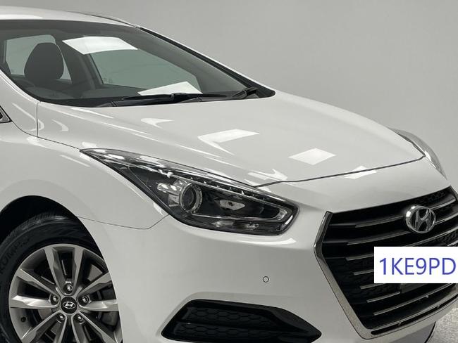 2017 Hyundai i40 white wagon with registration 1KE9PD.