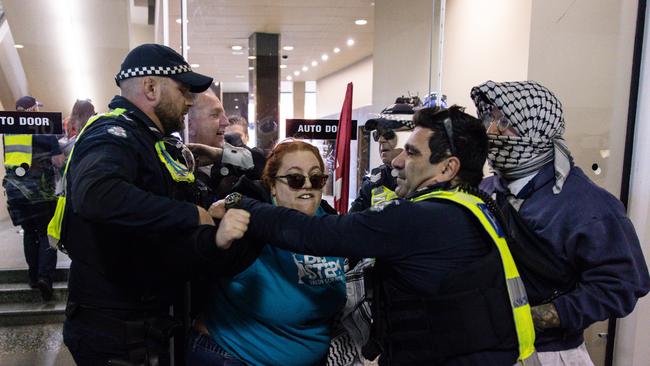 Pro-Palestine protesters are seen in a confrontation with members of Victoria Police as they attempted to enter the Moonee Valley Racecourse as the ALP Conference occurred inside. Picture: NCA NewsWire / Diego Fedele