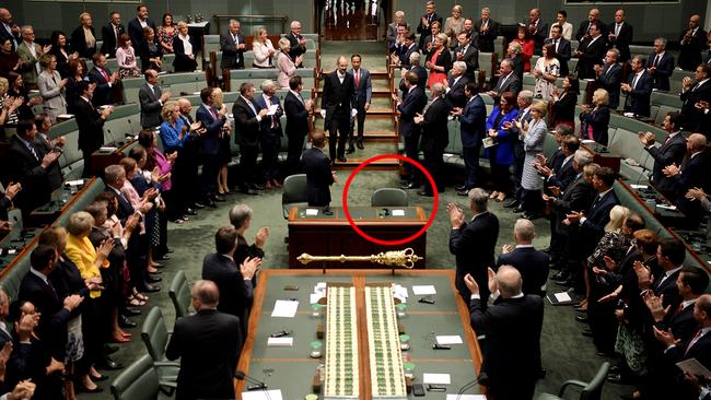 Indonesian president Joko Widodo enters parliament yesterday ... with the empty chair in full view. Picture: Getty Images