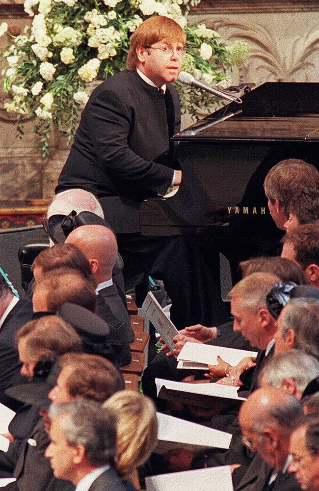 Elton John sings "Candle in the Wind" at the funeral of the Princess of Wales.