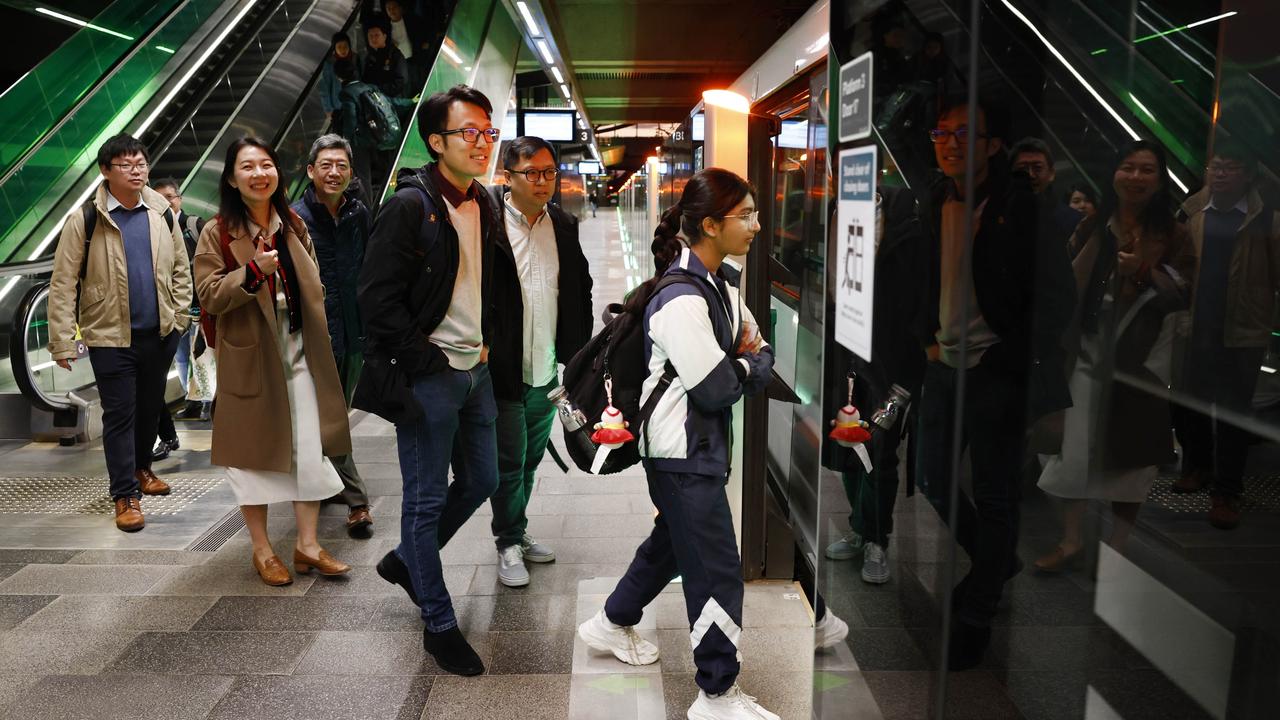 Pictured at Tallawong Station are MTR employees and commuters boarding one of the first Sydney Metro trains on its way back in to the city. The brand new Sydney Metro had its maiden run to Tallawong leaving Sydenham Station at 4.54am. Picture: Richard Dobson