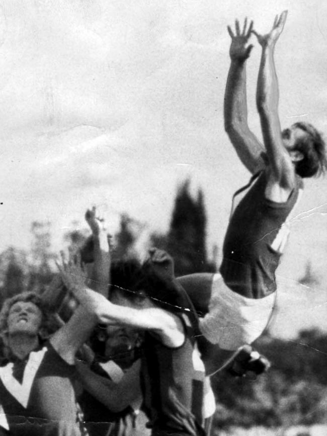 North Adelaide legend Barrie Robran flies for a mark at Prospect Oval in 1974.