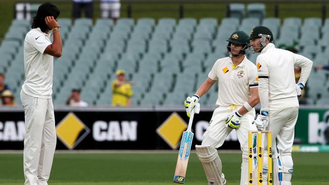 Ishant Sharma has a chat with Steve Smith and Michael Clarke during the 2014 Test. Picture: Simon Cross