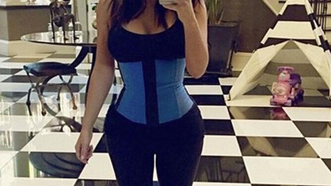 Kim Kardashian sports a corset at the gym