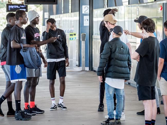 Two boys were assaulted at the Wyndham Vale train station about 7.10pm last night. They were robbed and assaulted by a group of African youths. Two gangs of youths face off at Wyndham Vale station. Picture: Jake Nowakowski