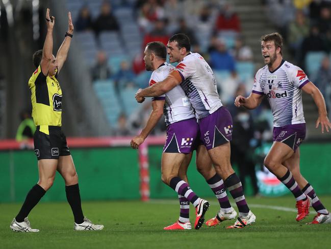 Melbourne's Cameron Smith celebrates after scoring a try late in the first half. Picture: Brett Costello