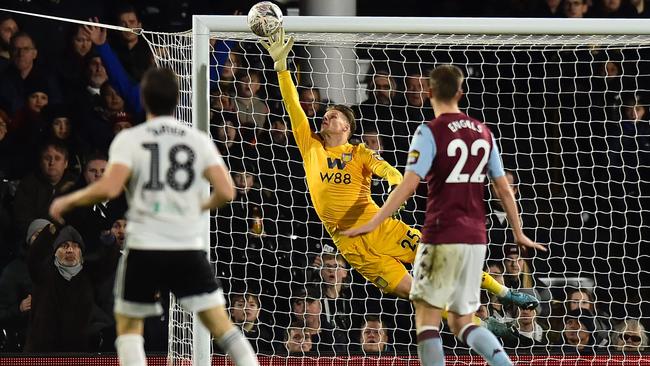 Fulham midfielder Harry Arter, left, watches as his long-range shot beats the dive of Aston Villa goalkeeper Orjan Nyland at Craven Cottage. Picture: AFP