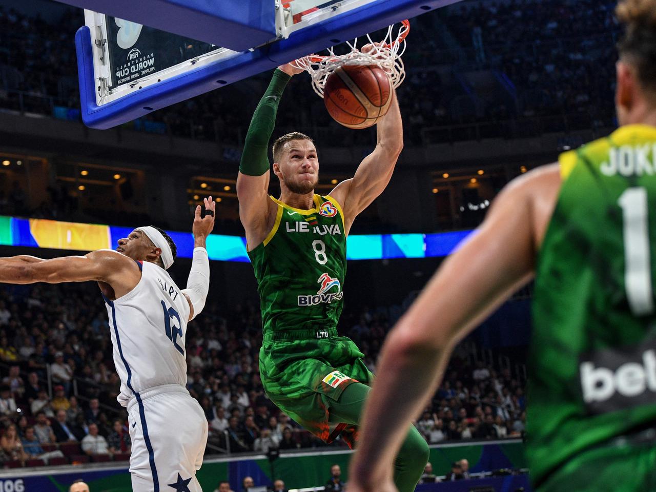 Lithuania's Tadas Sedekerskis (C) dunks against the US. Picture: Ted Aljibe/AFP