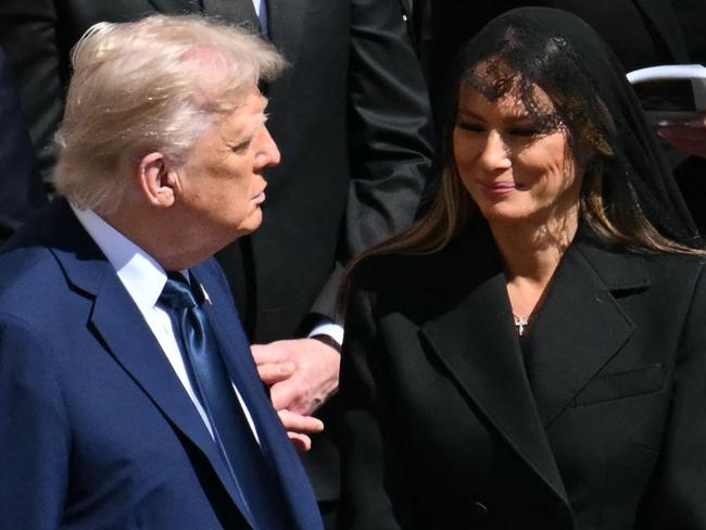 US President Donald Trump (L) and First Lady Melania Trump stand alongside leaders as they attend the late Pope Francis' funeral ceremony at St Peter's Square at the Vatican on April 26, 2025. (Photo by Mandel NGAN / AFP)
