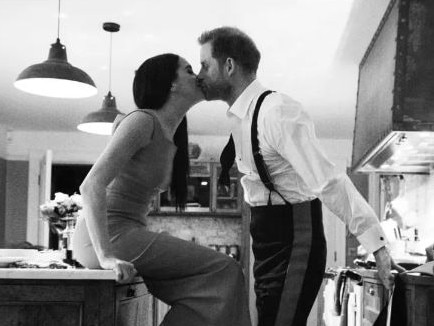 The couple shares a kiss in the kitchen after announcing their plans to step back from royal duty. Picture: Netflix