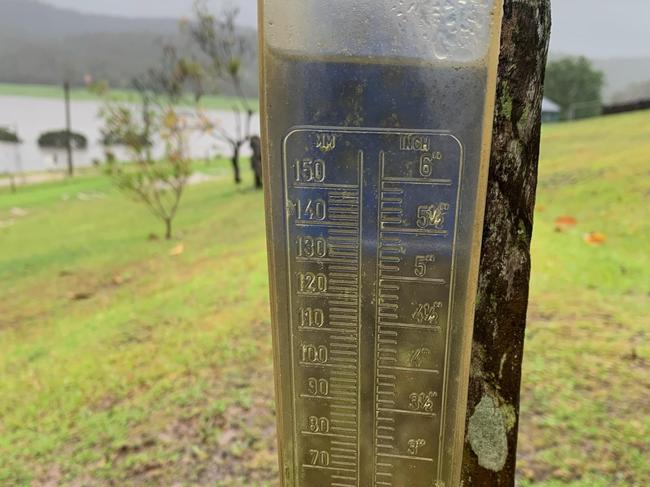 An overflowing rain gauge on a farm at Genoa in far East Gippsland. Picture: Supplied