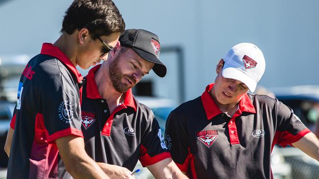 Lauderdale coach Daniel Willing, centre, gave his team a spray at half-time for their “unacceptable” performance. Picture: Linda Higginson